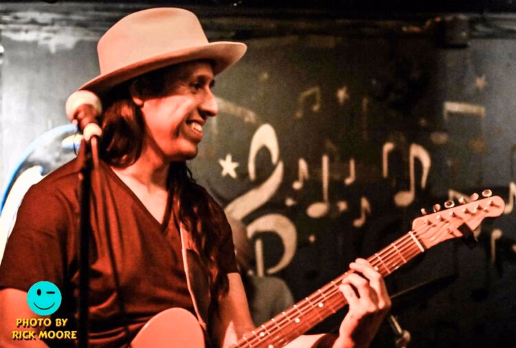 Is the guitarist in Roadhouse blind?